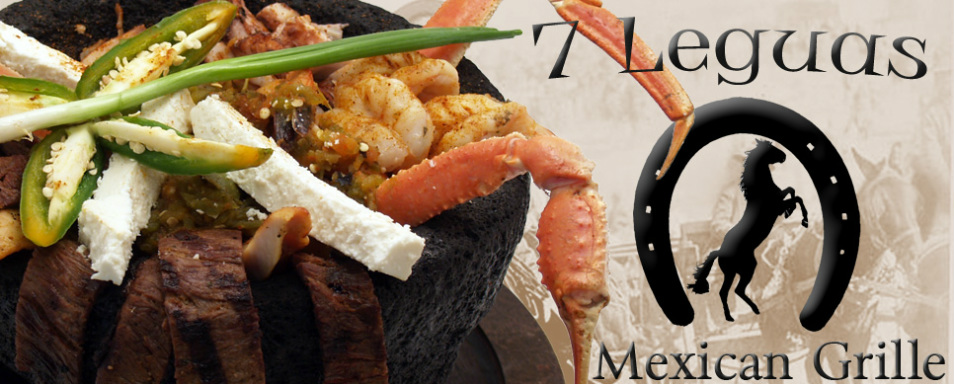 Molcajete served on volcanic stone with steak, shrimp, crab legs, and queso fresco at 7 Leguas Mexican Grille