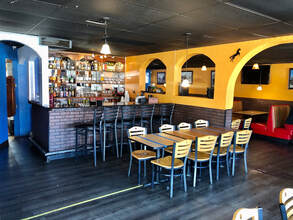 Interior bar and dining area at 7 Leguas Mexican Grille with arched cantina-style walls